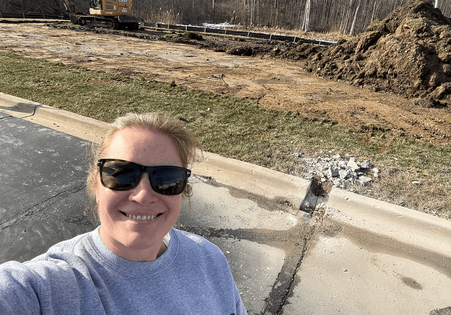woman posing in front of construction site